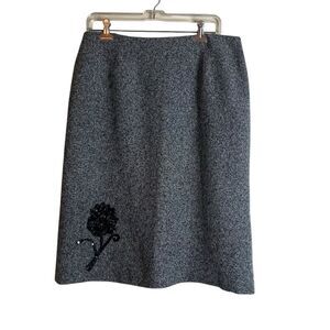 Melrose grey tweed like shirt with flower detail.